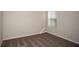 This bedroom has neutral walls, carpeting, and a window for natural light at 37009 Sagemoor Dr, Zephyrhills, FL 33541