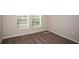 Cozy bedroom featuring plush carpet, ample natural light, and neutral paint tones at 37009 Sagemoor Dr, Zephyrhills, FL 33541