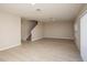 Spacious living area with sleek flooring, staircase, and lots of natural light at 37009 Sagemoor Dr, Zephyrhills, FL 33541