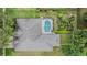 Aerial view of a well-maintained home featuring a screened-in pool and landscaped backyard at 4418 Gentrice Dr, Valrico, FL 33596