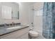 Clean bathroom with a combination shower and tub, featuring neutral color scheme and modern fixtures at 4418 Gentrice Dr, Valrico, FL 33596