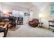 Spacious room with ample lighting, a large leather chair, a computer desk, and a keyboard at 4418 Gentrice Dr, Valrico, FL 33596