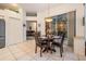 Bright breakfast nook area features a round table with views of the lanai and backyard at 4418 Gentrice Dr, Valrico, FL 33596