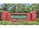 Beautiful Lithia Ridge community sign set in red brick and lush green foliage at 4418 Gentrice Dr, Valrico, FL 33596