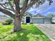 Charming single-story home with a manicured lawn and attached two-car garage at 4418 Gentrice Dr, Valrico, FL 33596