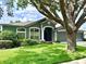 Charming single-story home with a manicured lawn and attached two-car garage at 4418 Gentrice Dr, Valrico, FL 33596