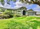 Charming single-story home with a manicured lawn and attached two-car garage at 4418 Gentrice Dr, Valrico, FL 33596