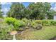 Charming garden with a variety of plants, decorative accents, and a bird bath at 4418 Gentrice Dr, Valrico, FL 33596