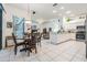 Open-concept kitchen with modern appliances, ample counter space, and an adjacent breakfast nook with backyard views at 4418 Gentrice Dr, Valrico, FL 33596