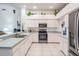 Bright kitchen featuring white cabinetry, stainless steel appliances, and recessed lighting at 4418 Gentrice Dr, Valrico, FL 33596