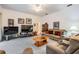 Comfortable living room with plush seating, entertainment center, and carpeted floors at 4418 Gentrice Dr, Valrico, FL 33596