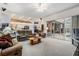 Spacious living room with an open layout and easy access to the kitchen and outdoor patio at 4418 Gentrice Dr, Valrico, FL 33596