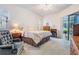 Comfortable bedroom with sliding glass door offering access to outdoor seating area at 4418 Gentrice Dr, Valrico, FL 33596