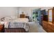 Calm bedroom with natural light and direct access to a pool view at 4418 Gentrice Dr, Valrico, FL 33596