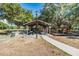 Community picnic area with covered tables, playground, and lush green surroundings, perfect for gatherings at 4418 Gentrice Dr, Valrico, FL 33596