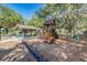 Charming wooden playground with picnic pavilion, perfect for Gathering fun in a serene setting at 4418 Gentrice Dr, Valrico, FL 33596