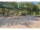 Fun-filled playground with swings, climbing wall, and play structure, shaded by mature trees at 4418 Gentrice Dr, Valrico, FL 33596