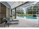 Inviting screened-in patio with a sparkling pool and comfortable lounge chairs, perfect for outdoor relaxation at 4418 Gentrice Dr, Valrico, FL 33596