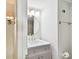 Bathroom with a modern vanity, round mirror and contemporary lighting at 4506 La Capri Ct, Tampa, FL 33611