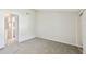 Empty bedroom with neutral walls, carpet flooring and an open doorway at 4506 La Capri Ct, Tampa, FL 33611