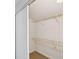Bright closet space featuring wire shelving for organized storage at 4506 La Capri Ct, Tampa, FL 33611