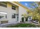 Well-maintained townhouse exterior with neat landscaping and a bench at 4506 La Capri Ct, Tampa, FL 33611