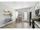 Cozy kitchen and dining area with stainless steel appliances and table near window with natural light at 4506 La Capri Ct, Tampa, FL 33611
