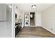 Bright kitchen with stainless steel appliances, white cabinets, in-unit laundry, and stairs to the next level at 4506 La Capri Ct, Tampa, FL 33611