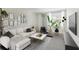 Bright living room featuring a comfortable white sectional sofa, stylish decor, and large window at 4506 La Capri Ct, Tampa, FL 33611