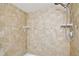 Walk in shower with beige tiling and tiled accents at 4506 La Capri Ct, Tampa, FL 33611