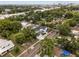Aerial perspective of a home nestled in a tree-filled neighborhood, near roads and city at 502 E Robles St, Tampa, FL 33602