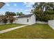 Charming backyard with a new building, a well-maintained lawn, and manicured shrubbery at 502 E Robles St, Tampa, FL 33602