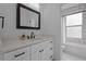 Bathroom featuring white vanity, modern fixtures, and shower-tub combination at 502 E Robles St, Tampa, FL 33602