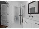 Bright bathroom with white tile, modern vanity, and separate toilet area, designed for comfort and style at 502 E Robles St, Tampa, FL 33602