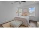 Inviting bedroom features a ceiling fan, multiple windows, and tasteful decor at 502 E Robles St, Tampa, FL 33602