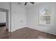 Bedroom showcasing a closet, wood floors, and a bright window illuminating the space at 502 E Robles St, Tampa, FL 33602