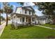 Charming two-story home with a welcoming front porch, landscaped yard, and fresh curb appeal at 502 E Robles St, Tampa, FL 33602