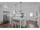 Bright kitchen features a center island with seating and modern stainless steel appliances at 502 E Robles St, Tampa, FL 33602