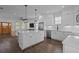 Bright kitchen boasts a large center island, stainless steel appliances, and sleek white cabinetry at 502 E Robles St, Tampa, FL 33602