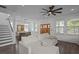 Open living room and dining area with abundant natural light, wood floors, and neutral decor at 502 E Robles St, Tampa, FL 33602