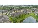 Beautiful aerial view of townhomes surrounding a serene pond in a well-maintained community at 5153 Bay Isle Cir, Clearwater, FL 33760
