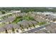 Scenic aerial view of a community with a pond, landscaped grounds, and well-maintained townhomes at 5153 Bay Isle Cir, Clearwater, FL 33760