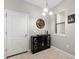 Bar area in neutral tones featuring cabinets, decor, and a modern light fixture at 5153 Bay Isle Cir, Clearwater, FL 33760