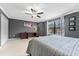 Bedroom features a ceiling fan, large window and carpeting throughout at 5153 Bay Isle Cir, Clearwater, FL 33760