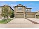 Two-story townhome featuring a two-car garage and neutral-toned exterior paint at 5153 Bay Isle Cir, Clearwater, FL 33760