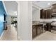 An open concept kitchen with stainless steel appliances and views into the living area at 5153 Bay Isle Cir, Clearwater, FL 33760
