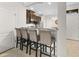 Modern kitchen features a breakfast bar with seating and stainless steel appliances at 5153 Bay Isle Cir, Clearwater, FL 33760