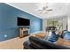 Comfortable living room with fireplace and open view to dining area and screened-in porch at 5153 Bay Isle Cir, Clearwater, FL 33760