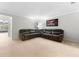 Inviting living room with plush sectional sofa and large windows for natural light at 5153 Bay Isle Cir, Clearwater, FL 33760