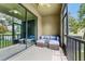 Comfortable screened patio with cozy seating overlooking a serene pond at 5153 Bay Isle Cir, Clearwater, FL 33760
